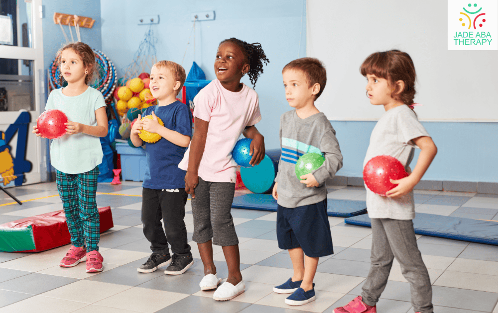 Children holding balls and participating in an activity